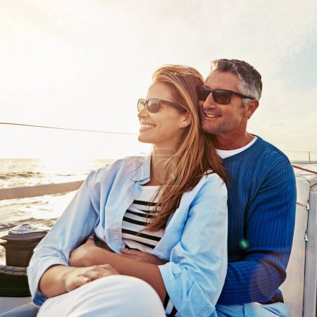 Photo for Look at that beautiful view. a couple enjoying a boat cruise out on the ocean - Royalty Free Image