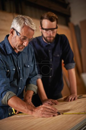 Photo for Hard work beats talent when talent doesnt work hard. a father and son working together in a workshop - Royalty Free Image
