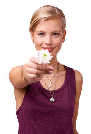Photo for From me to you. Studio portrait of a young woman holding up a flower isolated on white - Royalty Free Image