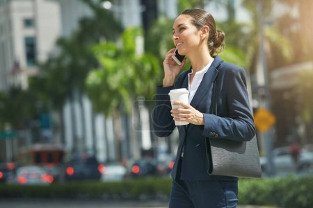 Photo for Her work style is mobile. a young businesswoman talking on her phone while out in the city - Royalty Free Image