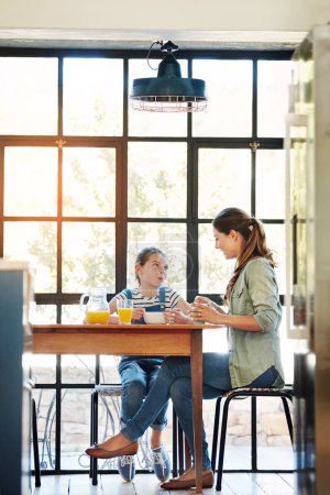Photo for No better time for bonding than at the breakfast table. a happy mother and daughter enjoying breakfast together at home - Royalty Free Image