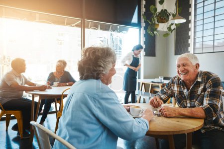 Photo for Sharing happy moments with my sweetheart. a senior couple out on a date at a coffee shop - Royalty Free Image