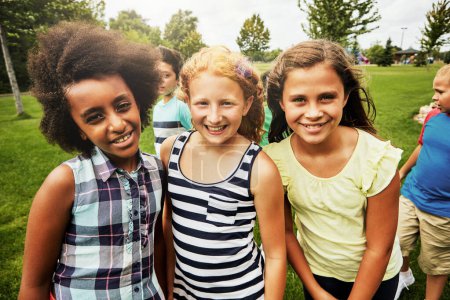 Photo for Best friends are the best part of childhood. Portrait of a group of diverse and happy kids hanging out together outside - Royalty Free Image