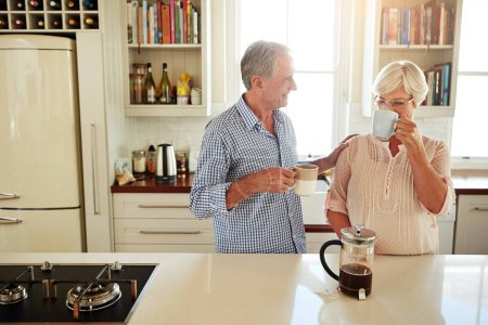 Photo for Successful marriage partners communicate as much as possible. a couple chatting over coffee at home - Royalty Free Image