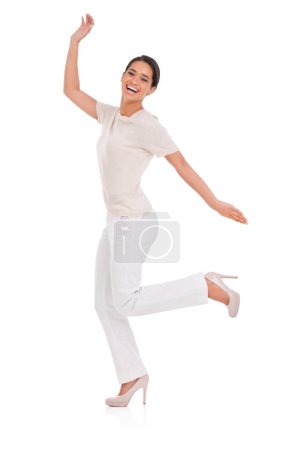 Téléchargez les photos : Shes chic and spontaneous. Studio shot of a beautiful ethnic woman leaping in her high heels - en image libre de droit