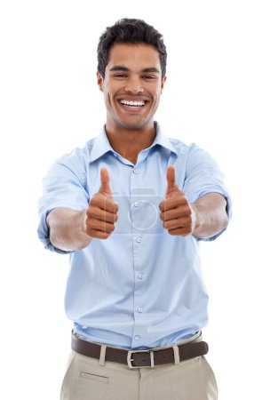 An enthusiastic approval. Studio shot of a young man giving the thumbs up sign isolated on white