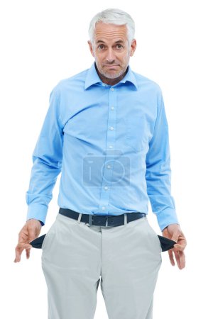 Photo for The economy takes its toll on everyone. Portrait of a handsome businessman showing you his empty pockets - Royalty Free Image