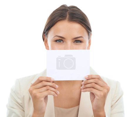 Photo for Your copyspace speaks a thousand words. Studio portrait of a young businesswoman holding a blank card in front of her mouth for copyspace isolated on white - Royalty Free Image