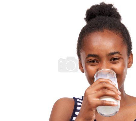 Photo for This milk is good. Studio portrait of a young african american girl drinking a glass of milk isolated on white - Royalty Free Image