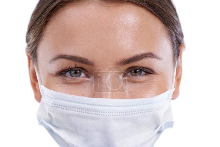 Photo for Youre in safe hands. A closeup image of a beautiful surgeon wearing a surgical mask - Royalty Free Image