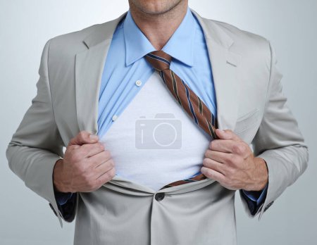 Photo for Your copyspace on the chest of a corporate hero. a businessman showing ripping his shirt open - Royalty Free Image