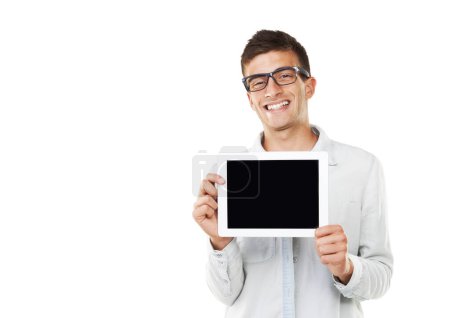 Photo for All my information is stored on here. A smiling man with hipster glasses holding a touch screen with a white background - Royalty Free Image