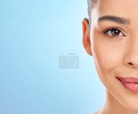 Photo for Skincare is healthcare. Studio portrait of an attractive young woman posing against a blue background - Royalty Free Image