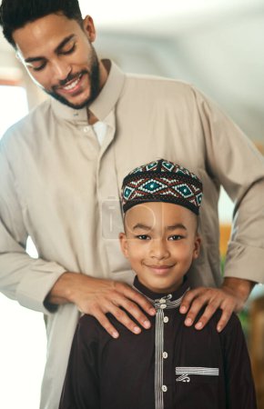Photo for Fathers should know that sons follow their example. Shot a young boy stand with his father at home - Royalty Free Image