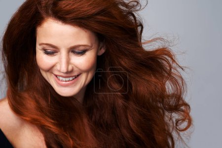Photo for Hair, salon and face of woman in studio for keratin treatment, wellness and haircare on gray background. Beauty, hairdresser mockup and happy female model with red, healthy and natural hairstyle. - Royalty Free Image