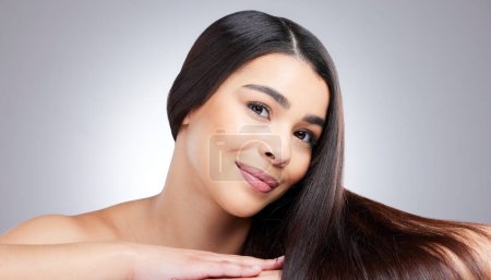 Photo for I feel totally confident in who I am becoming. Studio portrait of an attractive young woman posing against a grey background - Royalty Free Image