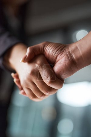Photo for Another successful deal made. two unrecognizable businesspeople shaking hands in an office - Royalty Free Image