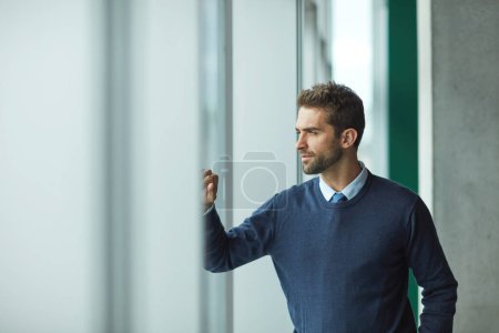 Photo for There are so many things I wish to achieve. a handsome young businessman standing alone and looking contemplative - Royalty Free Image