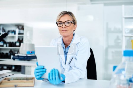 Photo for Capturing data with utmost ease. Portrait of a mature scientist using a digital tablet in a lab - Royalty Free Image
