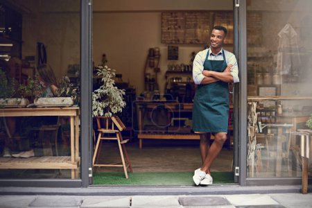 Photo for Thinking, coffee shop and man or small business owner at front door with a smile. Entrepreneur person as barista, manager or waiter in restaurant for service, career pride and startup goals. - Royalty Free Image