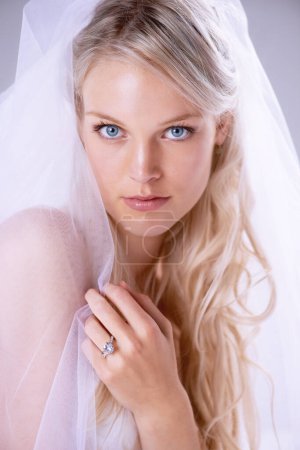 Photo for Portrait, beautiful bride and a wedding dress or woman in a lace veil and newlywed with diamond ring on finger. Face, bridal gown, makeup and hairstyle or jewellery for marriage and celebration. - Royalty Free Image