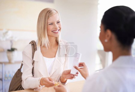 Photo for Happy, shopping and woman buying a skincare product by a sales consultant by the desk in store. Smile, credit card and female person paying for health, self care and beauty treatment at natural shop - Royalty Free Image