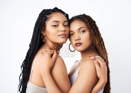 Photo for Your natural beauty is the masterpiece. Studio shot of two beautiful young women posing against a grey background - Royalty Free Image