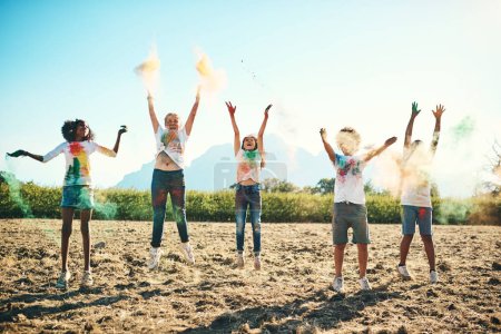Photo for Summer camp makes everything better and brighter. a group of teenagers having fun with colourful powder at summer camp - Royalty Free Image