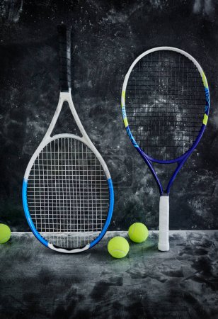 Photo for Were just hanging out. Studio shot of tennis essentials placed against a dark background inside of a studio - Royalty Free Image