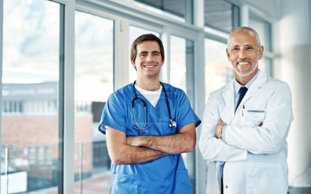 Photo for In the business of helping people get better. Portrait of two medical practitioners standing together in a hospital - Royalty Free Image