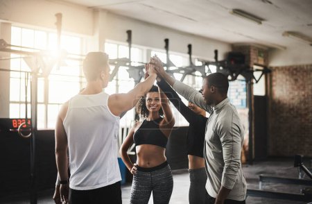 Photo for Their enthusiasm is their fuel. a group of young people giving each other a high five during their workout in a gym - Royalty Free Image