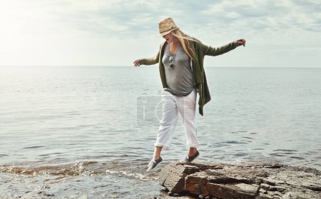 Photo for The best days are had outdoors. a young woman spending a day at the lake - Royalty Free Image