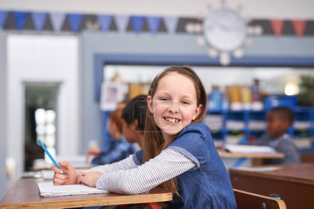 Photo for Her favourite lesson of the day. elementary school children in class - Royalty Free Image