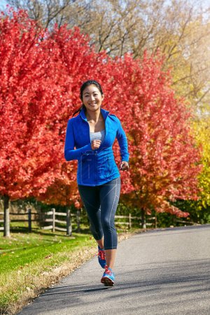Photo for Youll notice amazing changes to your overall health. a sporty young woman running outdoors - Royalty Free Image