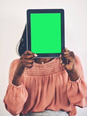 Photo for Its my essential business tool. a businesswoman holding a digital tablet with a green screen - Royalty Free Image