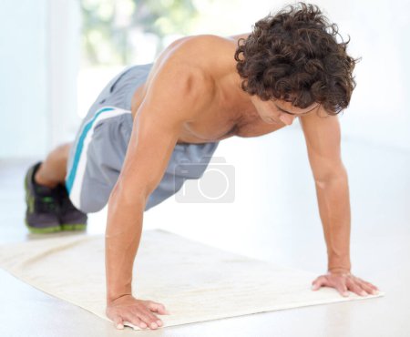Photo for Fitness, push up and bodybuilder man with strength, power and training or exercise on floor for health and muscle. Athlete, sports and young person with shoulder or arm workout on ground with focus. - Royalty Free Image