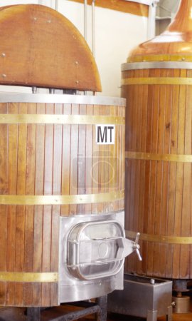 Photo for Brewery, machine and barrel for beer, alcohol and brewing process with a tap. Wooden, drum and alcoholic beverage at a distillery for storage, fermentation and manufacturing, industry or system. - Royalty Free Image