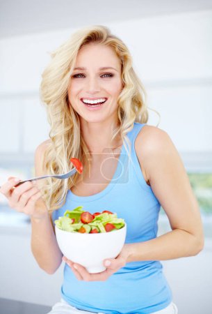 Woman, portrait smile and salad bowl for healthy eating, nutrition or dieting in the kitchen at home. Happy female person smiling in happiness for vegetable diet, organic meal or natural food indoors.