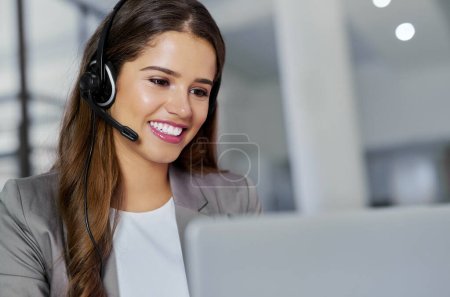 Photo for Going the extra mile is never an effort for her. a young call centre agent working in an office - Royalty Free Image