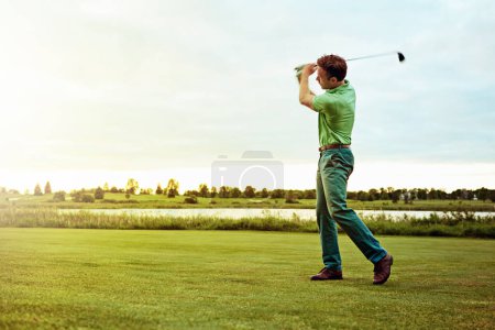 Photo for His best shot yet. a man practicing his swing on the golf course - Royalty Free Image
