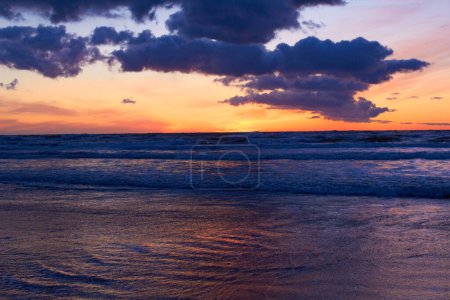 Photo for Nature, ocean and peace with sunset at beach for landscape, summer break and vacation travel. Cloud, waves and environment with sunrise at coastline for sea holiday, calm horizon and seascape. - Royalty Free Image