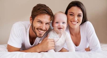 Photo for Happy portrait, dad and mom of baby kid on bed for love, care and quality time together to relax at home. Smile of family, parents and cute newborn child for development, caring support and happiness. - Royalty Free Image