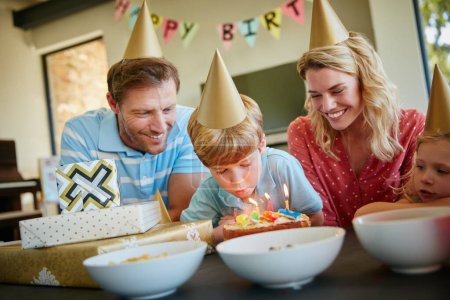 Photo for I wish for many more fun times with my family. a happy family having a birthday party at home - Royalty Free Image