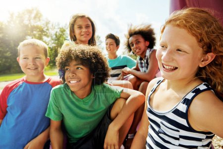 Photo for Theyve got a whole day of fun ahead. a group of diverse and happy kids hanging out together outside - Royalty Free Image