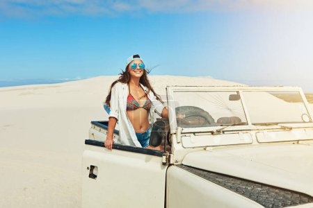 Photo for Discovering the beauty of the desert. a young woman going on a road trip in the desert - Royalty Free Image