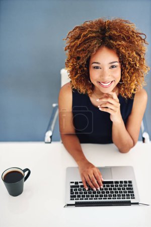 Photo for Turning my passion into profit with help from technology. Portrait of a young businesswoman working on a laptop at her desk - Royalty Free Image