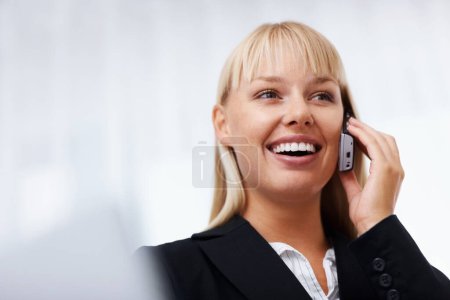 Photo for Young business woman on mobile. Closeup of business woman talking on cell phone - Royalty Free Image