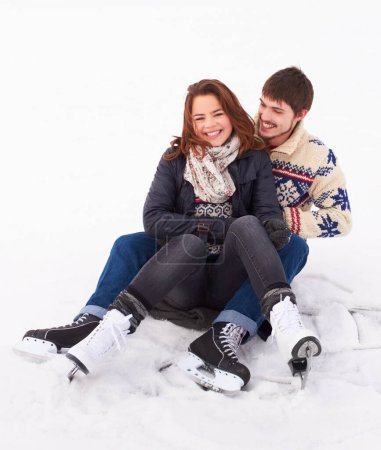 Photo for Couple in the snow, ice skating outdoor with happiness and spending quality time together, relax in winter weather. Happy people cuddling, skate on frozen lake and bond in nature with love and care. - Royalty Free Image