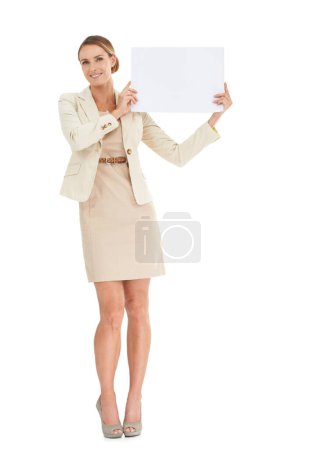Photo for Giving you her corporate endorsement. A beautiful businesswoman holding a blank placard - Royalty Free Image