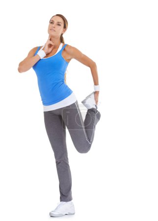 Foto de Comprobando su pulso después de un entrenamiento. Mujer joven y saludable en ropa deportiva estirándose mientras está aislada en blanco y tomando su pulso - Imagen libre de derechos